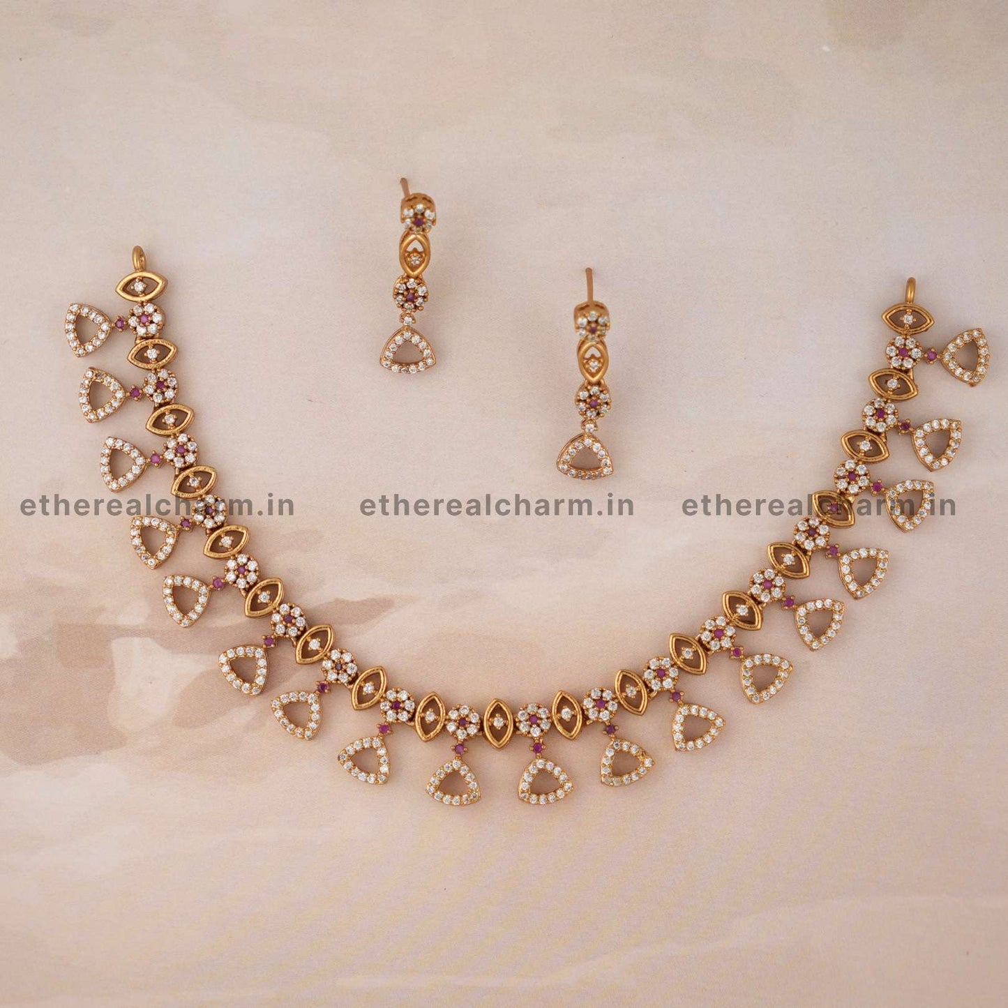 Triangular Elegance: Necklace Set with Dainty Motifs and Stone Accents