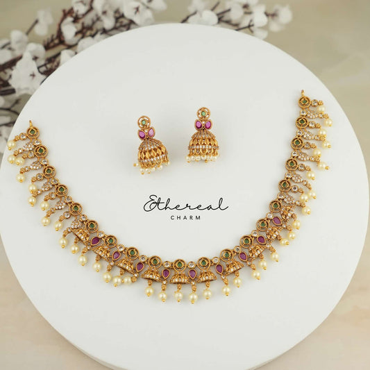 Festive Kundan Necklace with Pearl Drops and Temple Design Accents