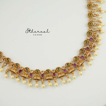 Festive Kundan Necklace with Pearl Drops and Temple Design Accents