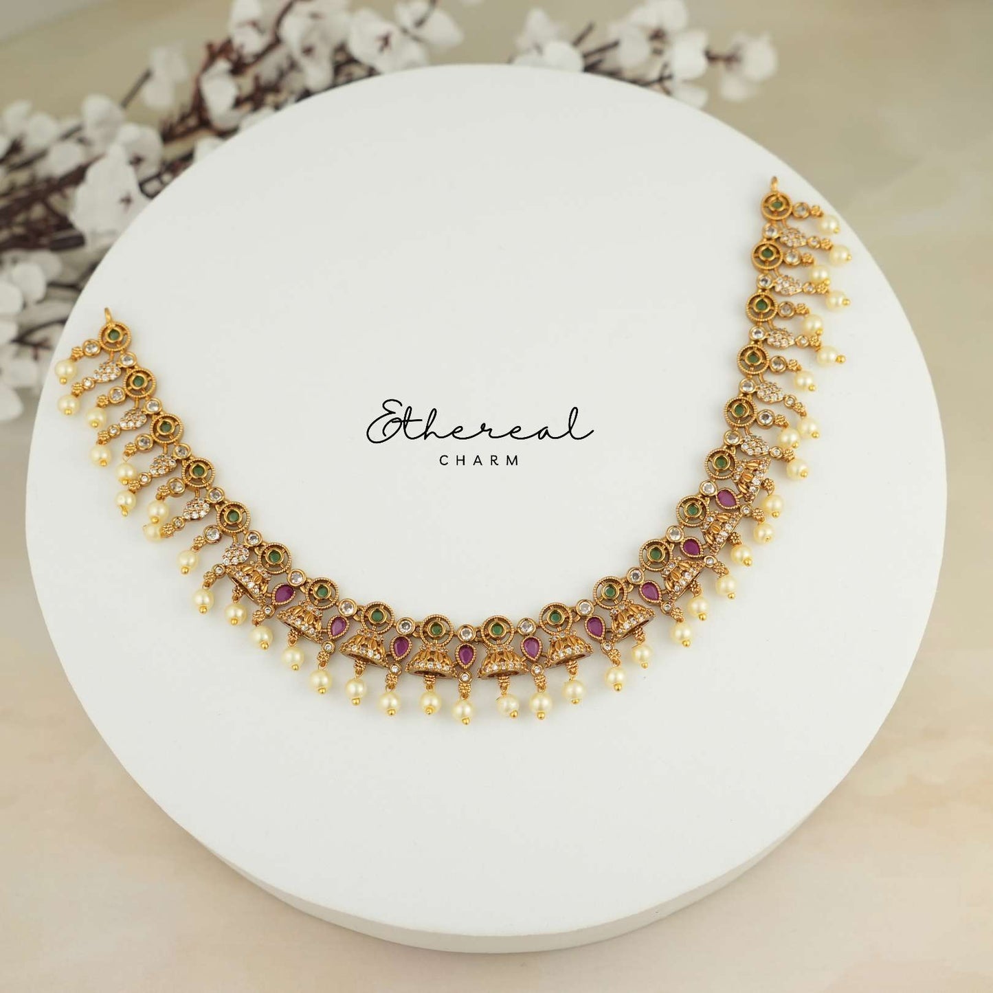 Festive Kundan Necklace with Pearl Drops and Temple Design Accents